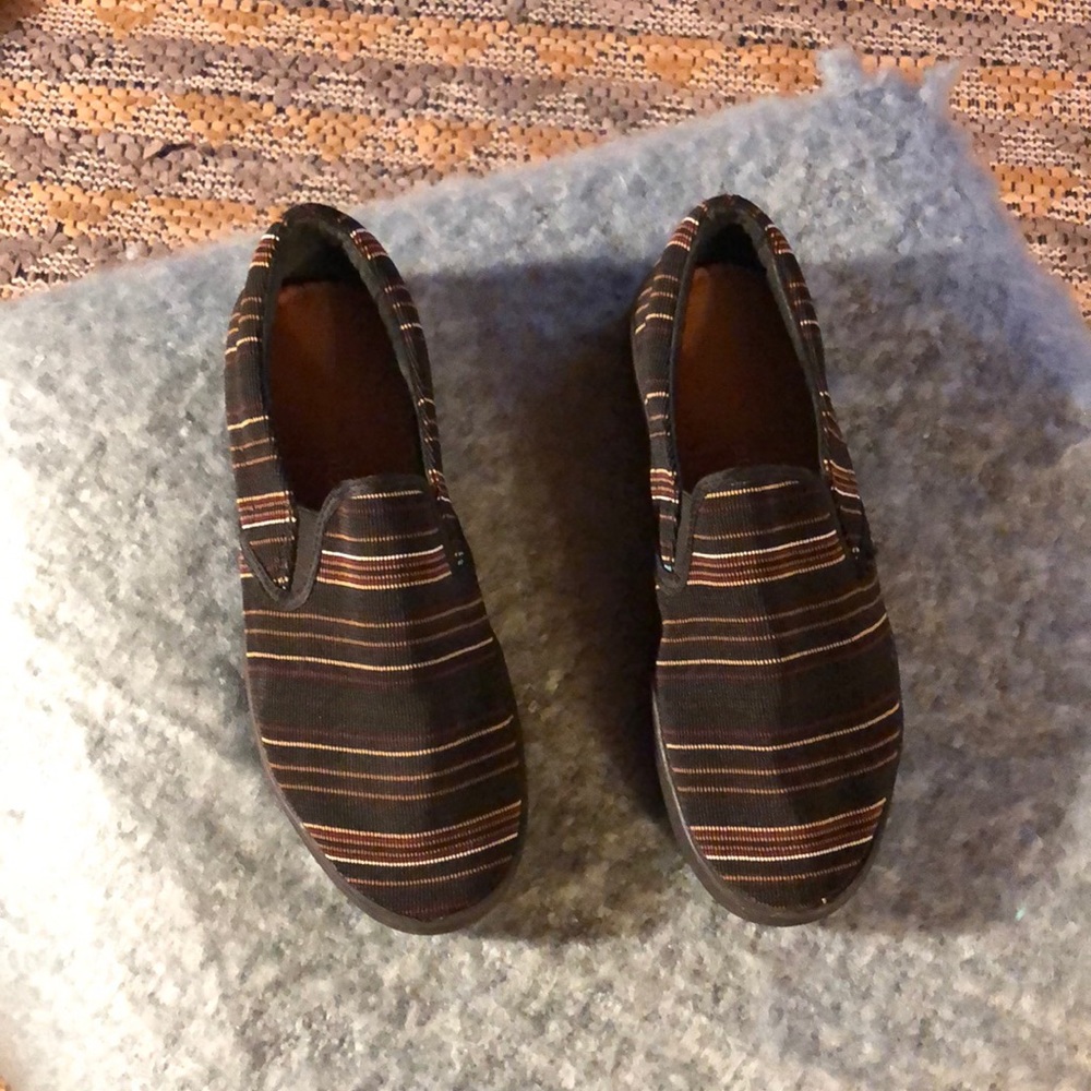 Black with neutral stripes.